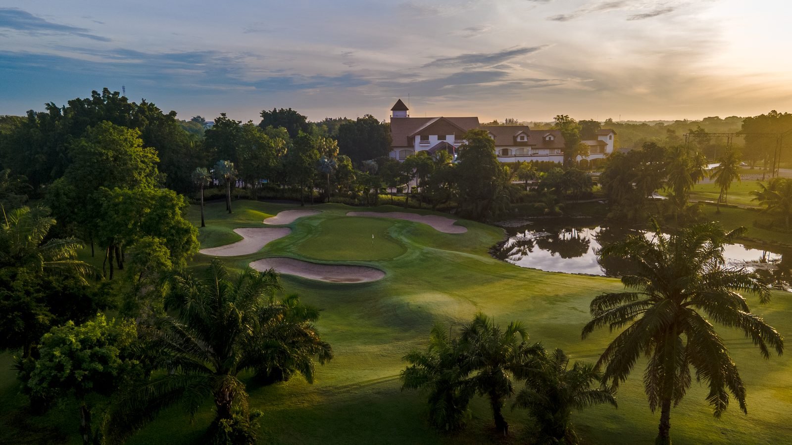 Sunrise over the Alpine Golf Club clubhouse and approach