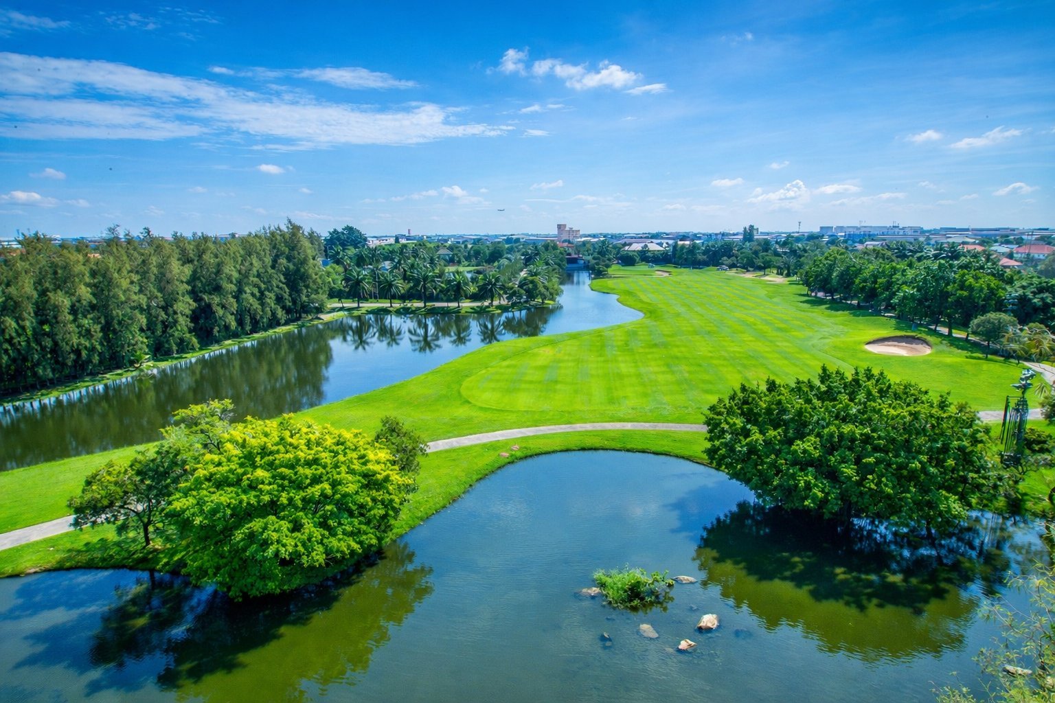 Water framing the fairway at Summit Windmill Golf Club, Bangkok