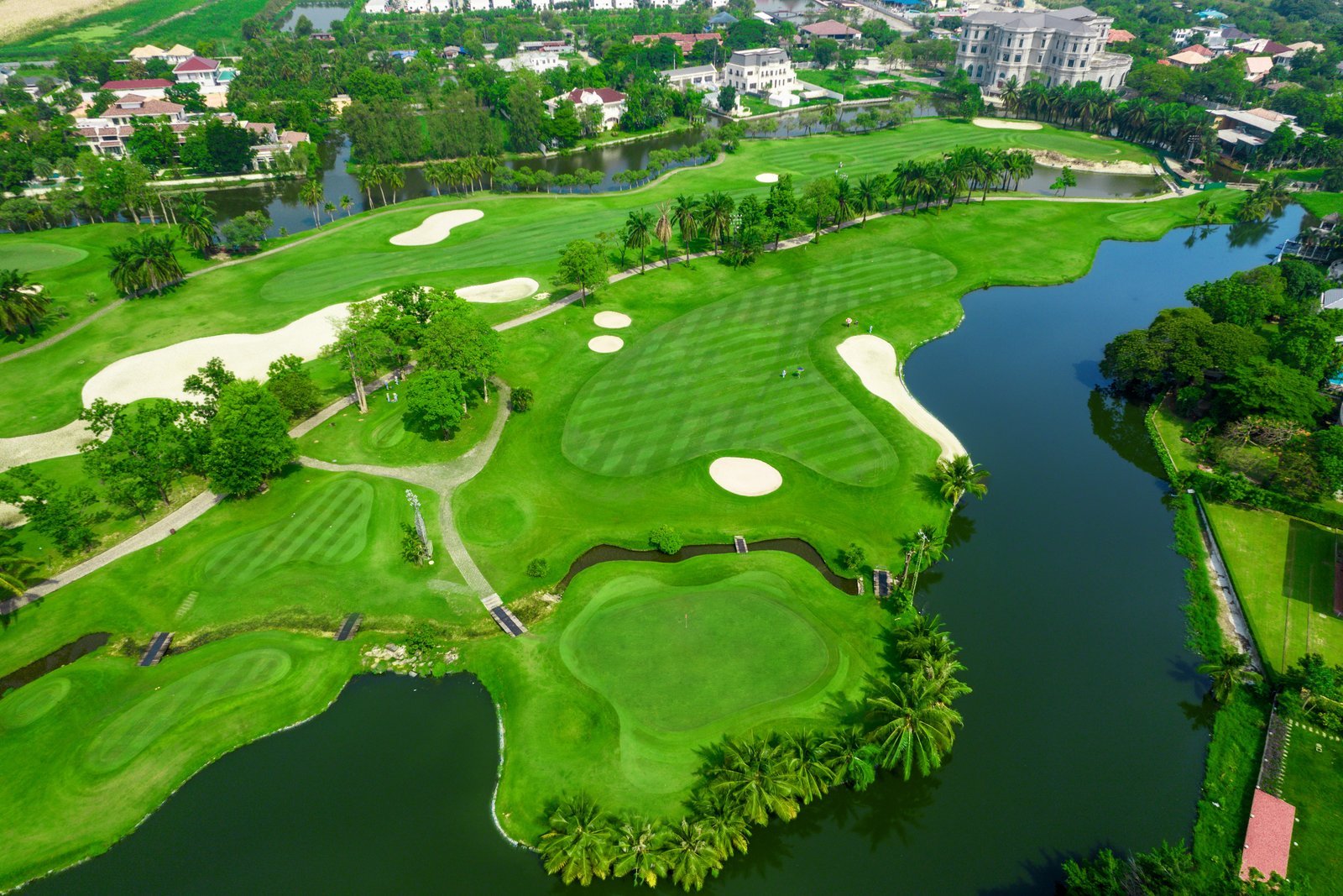 Aerial view of the 8th hole and its island-style green at Summit Windmill Golf Club