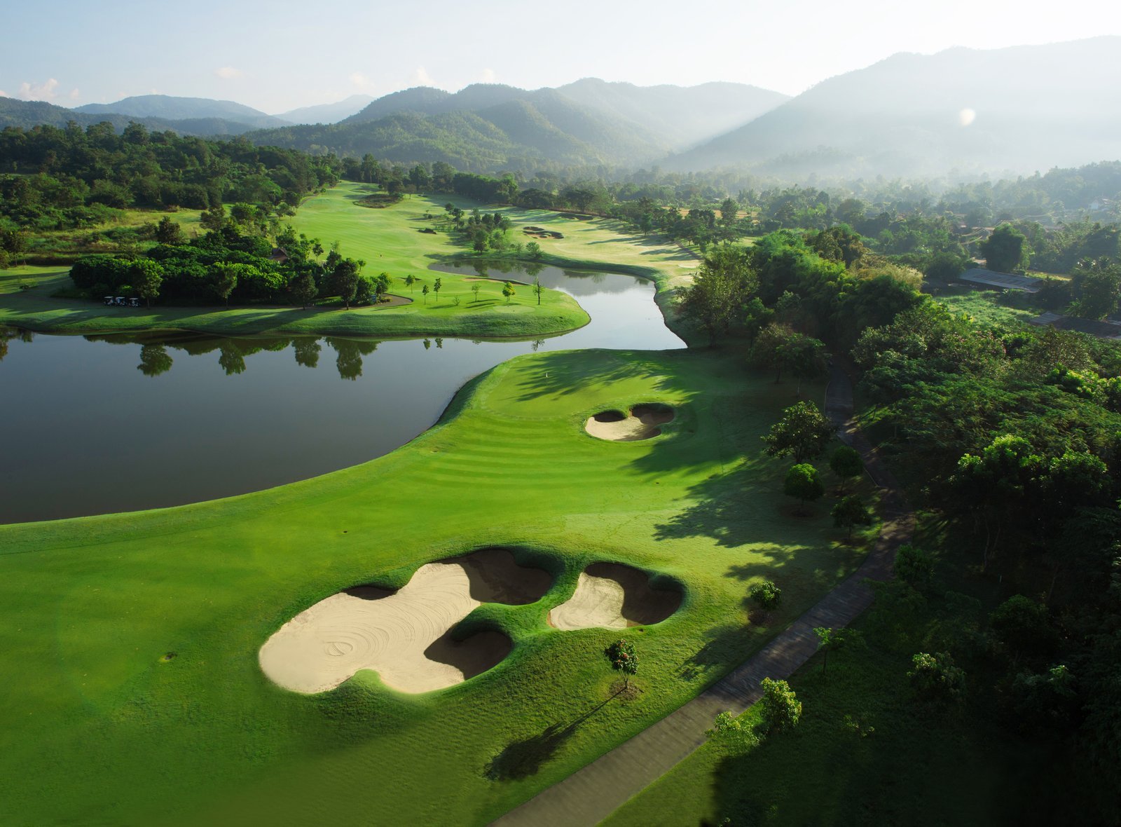Aerial of the 11th at Chiangmai Highlands, the fairway running alongside water